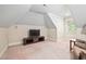 A bonus room featuring a TV and a comfortable seating area for relaxing and enjoying entertainment at 39 Forked Pine Ct, Chapel Hill, NC 27517