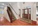 Grand foyer with hardwood floors, decorative front door, and staircase at 39 Forked Pine Ct, Chapel Hill, NC 27517