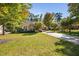 Charming single-story home featuring stone accents, a well-manicured lawn, and a long driveway at 39 Forked Pine Ct, Chapel Hill, NC 27517