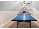 Spacious game room with three ceiling fans and a ping pong table for recreation and entertainment at 39 Forked Pine Ct, Chapel Hill, NC 27517