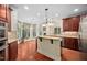 Open kitchen with granite counters, stainless appliances, and an adjacent breakfast nook at 39 Forked Pine Ct, Chapel Hill, NC 27517