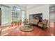Spacious living room with large windows, hardwood flooring, and elegant decor at 39 Forked Pine Ct, Chapel Hill, NC 27517