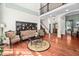 Open living room featuring hardwood floors, high ceilings, and traditional decor at 39 Forked Pine Ct, Chapel Hill, NC 27517