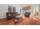 Cozy living room showcasing hardwood floors, natural light, and comfortable seating at 39 Forked Pine Ct, Chapel Hill, NC 27517