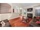 Inviting living room features hardwood floors, fireplace, and open access to the kitchen at 39 Forked Pine Ct, Chapel Hill, NC 27517