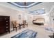 This is a wide angle shot of a spacious main bedroom with a sitting area and decorative ceiling at 39 Forked Pine Ct, Chapel Hill, NC 27517