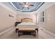 The serene main bedroom features a neutral color palette and access to a private outdoor space at 39 Forked Pine Ct, Chapel Hill, NC 27517