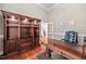 An office featuring a wooden desk and wooden built-in cabinets for storage and decor, creating an organized workspace at 39 Forked Pine Ct, Chapel Hill, NC 27517