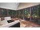Relax on this screened porch with a view of the wooded backyard at 39 Forked Pine Ct, Chapel Hill, NC 27517