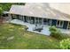 Aerial view of a home showcasing its expansive back deck, lush lawn, and tranquil surroundings at 4022 Tecolote Way, Hillsborough, NC 27278
