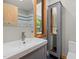 Well-lit bathroom features a stylish vanity and modern fixtures with natural light from the window at 4022 Tecolote Way, Hillsborough, NC 27278