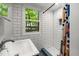 Modern bathroom with white subway tiles, walk-in shower, and a bright window at 4022 Tecolote Way, Hillsborough, NC 27278