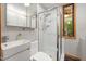 Modern bathroom with a sleek glass shower, updated fixtures, and ample lighting at 4022 Tecolote Way, Hillsborough, NC 27278