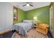 Inviting bedroom with warm colors, a cozy chair, and a plush rug at 4022 Tecolote Way, Hillsborough, NC 27278