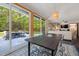 Elegant dining room with large windows offering views of the backyard and an open layout at 4022 Tecolote Way, Hillsborough, NC 27278