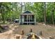 Charming cabin in the woods featuring a cozy porch and fire pit at 4022 Tecolote Way, Hillsborough, NC 27278