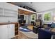 Relaxing living space featuring wood floors, comfortable seating, and well-organized storage above at 4022 Tecolote Way, Hillsborough, NC 27278