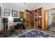 Functional office with custom bookshelves, work station, and a comfortable layout at 4022 Tecolote Way, Hillsborough, NC 27278