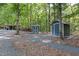 Various storage outbuildings located on a secluded property with mature trees at 4022 Tecolote Way, Hillsborough, NC 27278