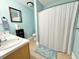 Bright bathroom featuring double sinks, a bathtub/shower combo, vanity and tile flooring at 4057 Old Franklinton Rd, Franklinton, NC 27525