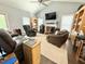 Inviting living room featuring vaulted ceilings, a fireplace, and comfortable seating arrangements at 4057 Old Franklinton Rd, Franklinton, NC 27525
