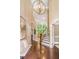 Grand foyer with high ceilings, hardwood floors, a staircase, and ample natural light, creating a welcoming entrance at 412 Bowen Rd, Rougemont, NC 27572