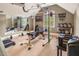 Home gym with weight training equipment, mirrors, and natural lighting at 412 Bowen Rd, Rougemont, NC 27572