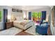 Bright bedroom with a plush king-sized bed and private deck access at 412 Bowen Rd, Rougemont, NC 27572