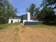 The backyard has a blue wall that divides the property from the street at 4501 Rockwood Dr, Raleigh, NC 27612