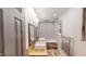 Modern bathroom features a double sink vanity, tub with tiled walls, and a window with natural light at 4501 Rockwood Dr, Raleigh, NC 27612