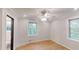 Bedroom features a ceiling fan, multiple windows for natural light, and a bathroom at 4501 Rockwood Dr, Raleigh, NC 27612