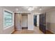 Bedroom features a ceiling fan, windows for natural light, and a sliding barn door to closet at 4501 Rockwood Dr, Raleigh, NC 27612