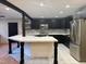 Beautiful kitchen featuring stainless steel appliances and a large island at 4501 Rockwood Dr, Raleigh, NC 27612