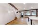 Open-concept, with hardwood floors, rustic beams, and a staircase leading to a different level at 4501 Rockwood Dr, Raleigh, NC 27612