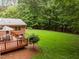 A well-maintained wooden deck overlooks the grassy backyard, offering a serene space for outdoor enjoyment at 4505 Wood Valley Dr, Raleigh, NC 27613
