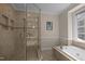 Spa-like bathroom showcasing a large soaking tub and a separate glass shower at 4505 Wood Valley Dr, Raleigh, NC 27613