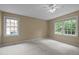 Clean, minimalist bedroom with natural light and neutral tones at 4505 Wood Valley Dr, Raleigh, NC 27613