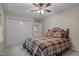 Bedroom features closet, fan, and a window view at 4505 Wood Valley Dr, Raleigh, NC 27613