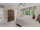 Cozy bedroom featuring a ceiling fan, natural light, and a spacious wardrobe at 4505 Wood Valley Dr, Raleigh, NC 27613
