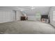 Spacious bonus room features a wet bar, neutral colors, ceiling fans and plush carpet at 4505 Wood Valley Dr, Raleigh, NC 27613