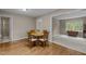 Charming dining area with hardwood floors and a view into the adjacent sitting room at 4505 Wood Valley Dr, Raleigh, NC 27613