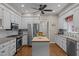Modern kitchen featuring white cabinets, stainless steel appliances, and a butcher block island at 4505 Wood Valley Dr, Raleigh, NC 27613