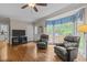 Spacious living room featuring hardwood floors, comfortable seating, and a view of the deck from the bay window at 4505 Wood Valley Dr, Raleigh, NC 27613