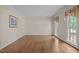 Inviting living room with hardwood floors and large windows that offer generous natural light and a serene atmosphere at 4505 Wood Valley Dr, Raleigh, NC 27613