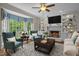 Cozy living room with a fireplace, built-in shelves, and a bay window for plenty of sunlight at 4505 Wood Valley Dr, Raleigh, NC 27613