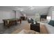 Open living room features a billiards table, a bar, and entertainment area at 4505 Wood Valley Dr, Raleigh, NC 27613
