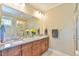Well-lit bathroom with a granite countertop and a glass-enclosed shower at 457 S Greensboro St, Carrboro, NC 27510