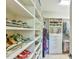 Walk-in closet with custom shelving and ample space for storage and organization at 457 S Greensboro St, Carrboro, NC 27510