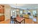Charming dining area adjacent to an open floor plan with the kitchen, living room, and an abundance of natural light at 457 S Greensboro St, Carrboro, NC 27510