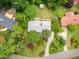 Aerial view of a home with a well-manicured yard, mature trees, and a private setting at 4832 Brookhaven Dr, Raleigh, NC 27612